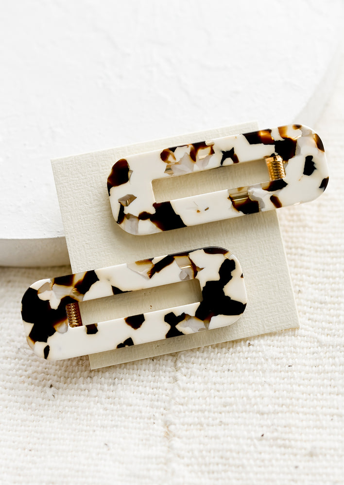 Coco Cream Tortoise: A pair of open rectangle shaped acetate hair clips in coco cream tortoiseshell print.
