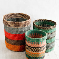 2: Three woven storage baskets in incremental sizes and different colored striped patterns.