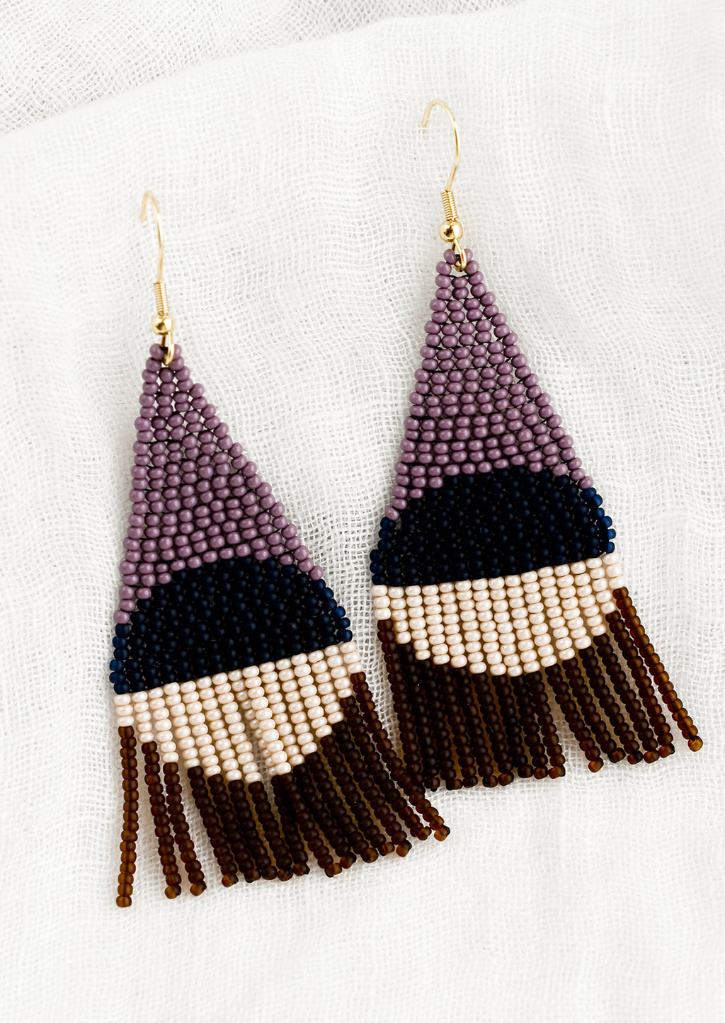 Concord Multi: A pair of geometric beaded earrings in purple colorway.