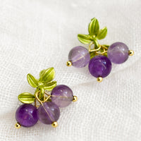 Grape: A pair of earrings made to resemble grapes, made with round amethyst beads.