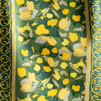 2: A block printed table runner in green and yellow print.