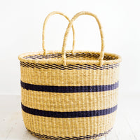 Medium: Round straw storage basket with handles at top and navy blue stripes throughout