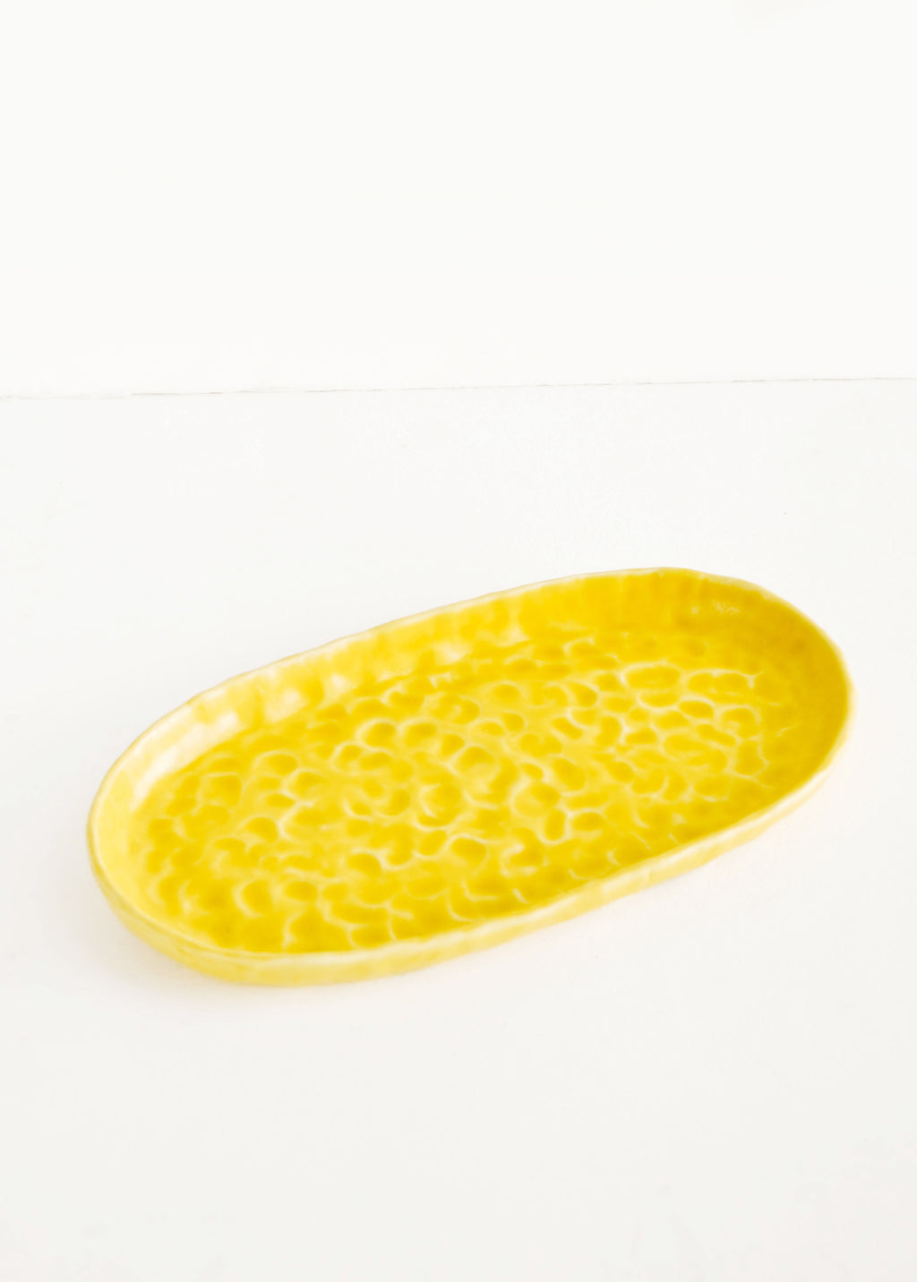 Daybreak: Dapple Textured Oval Shaped Ceramic Trays in Yellow  - LEIF