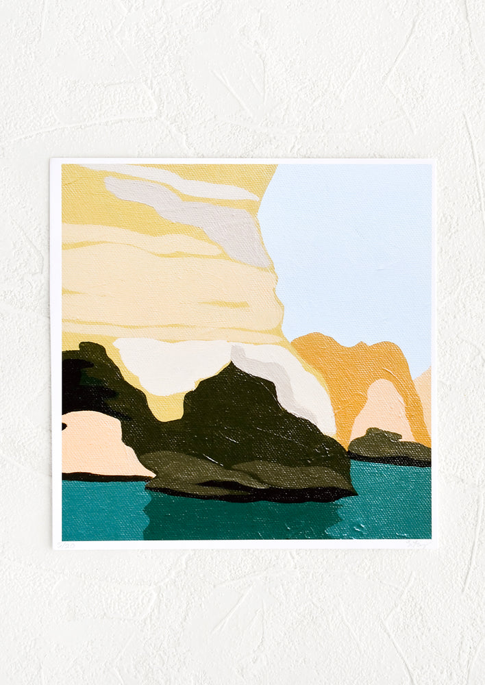 A square-shaped art print with image of a grotto setting in yelllow, orange, and greens.