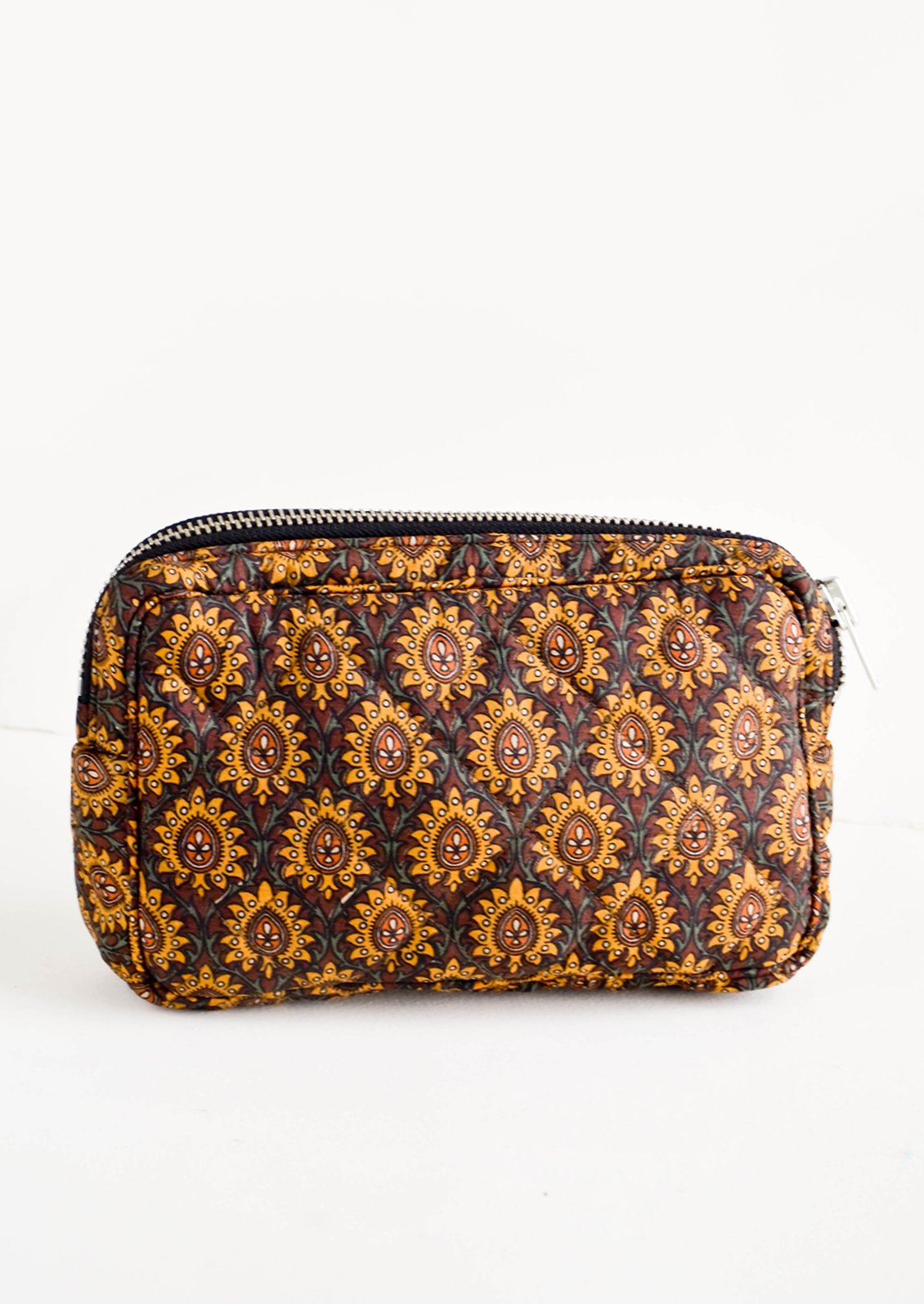 Flat and rectangular makeup travel bag with zip closure in brown talisman print