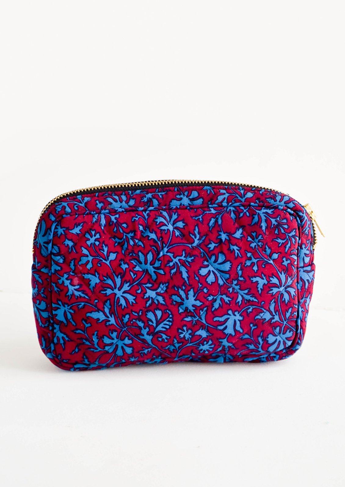 Flat and rectangular makeup travel bag with zip closure in wine & turquoise leaf print