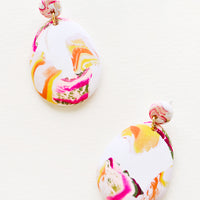 Sea Smoke: Pink, yellow, orange and white marbled clay earrings, with a larger oval dangling from a small circle.