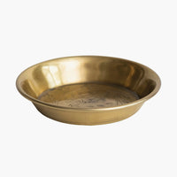 3: A small, round and shallow brass dish with floral engraving.