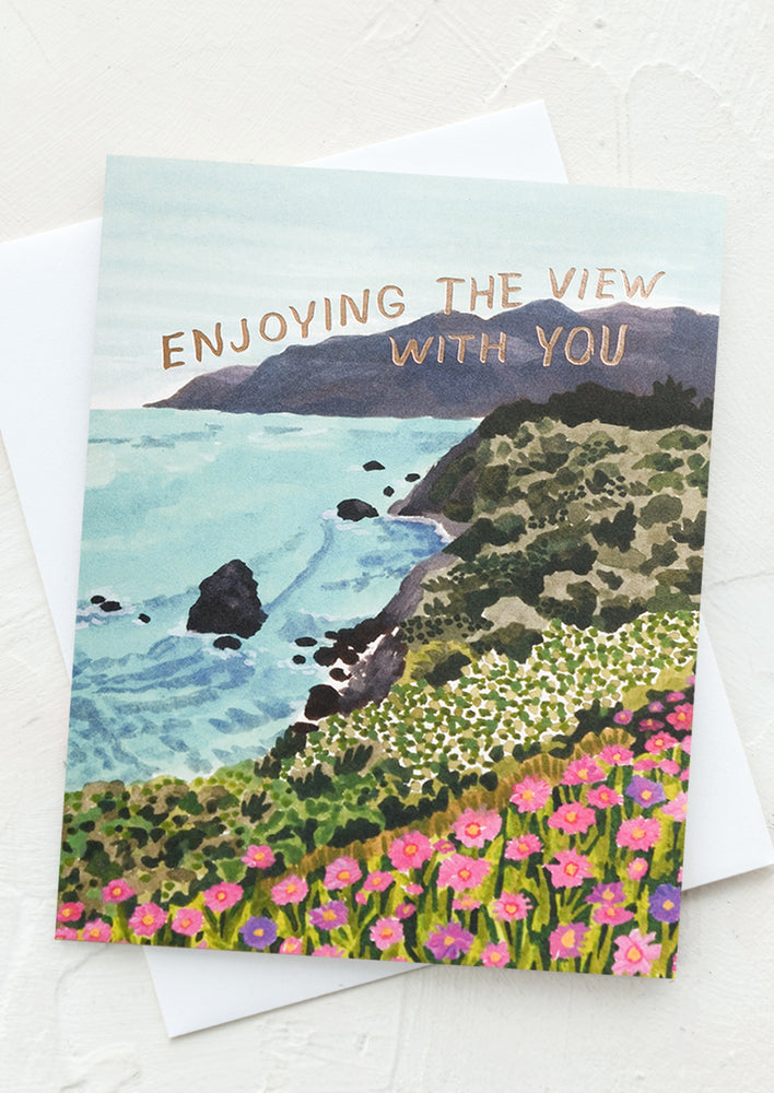 A card with coastline scene reading "Enjoying the view with you".