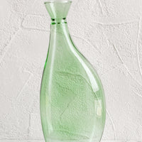 Large: A tall, asymmetric glass vase in translucent green glass.