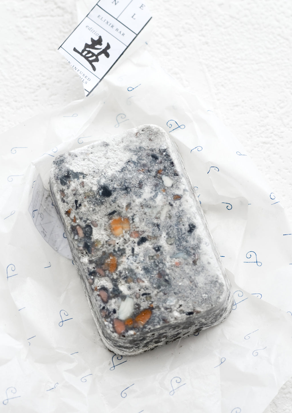 Brine: A bar of soap in grey speckled texture.