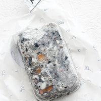 Brine: A bar of soap in grey speckled texture.
