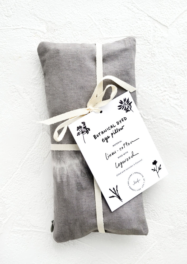 A naturally dyed relaxation eye pillow in dark grey and white tie dye.