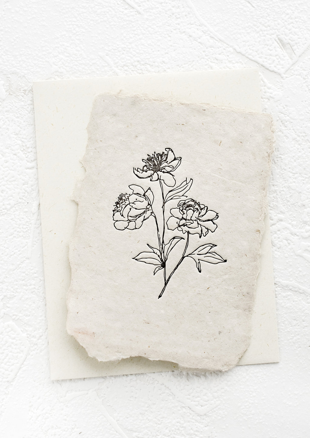 2: A greeting card made from handmade paper with a letterpress printed image of peony stems.