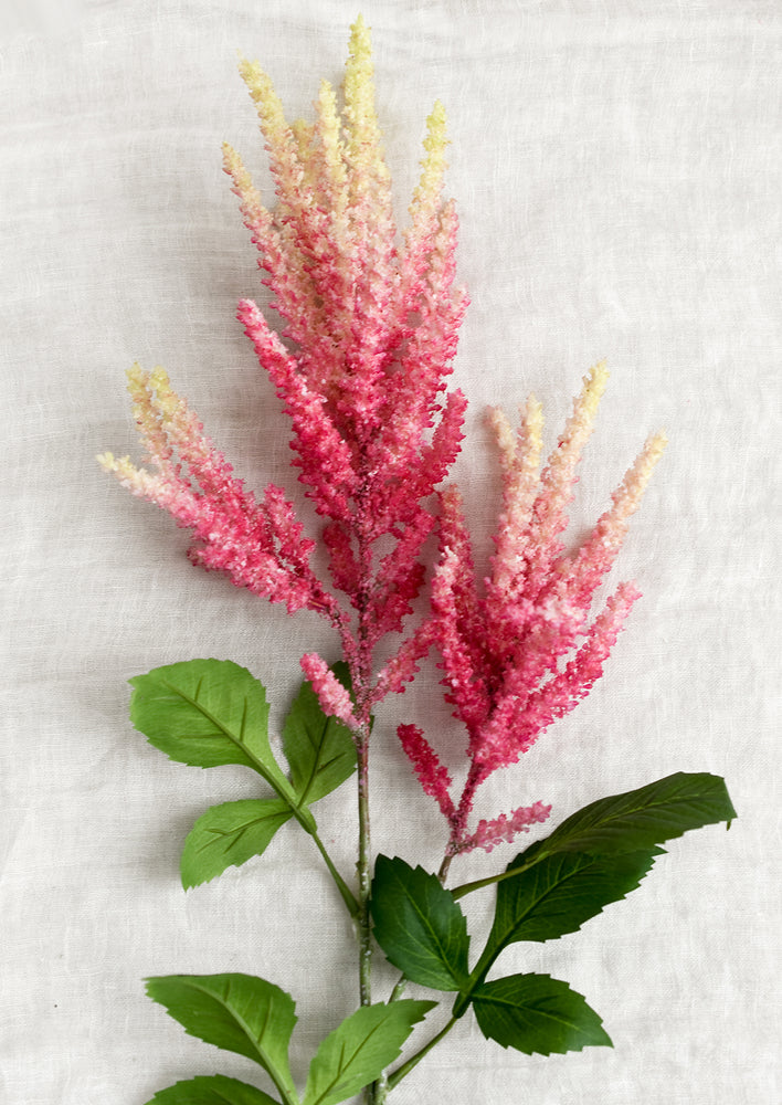 1: A faux astilbe flower in pink.