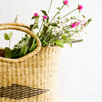 2: Wildflowers placed inside a woven tote bag made from natural elephant grass