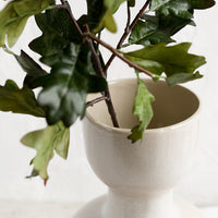 2: A faux oak leaf stem in a vase.