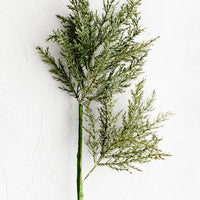 1: A faux greenery stem.