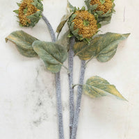 2: Multiple faux sunflower stems.