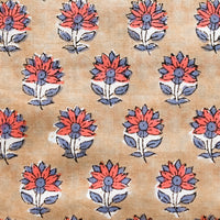 2: A block printed pillow in light brown with red and dusty blue flower print.