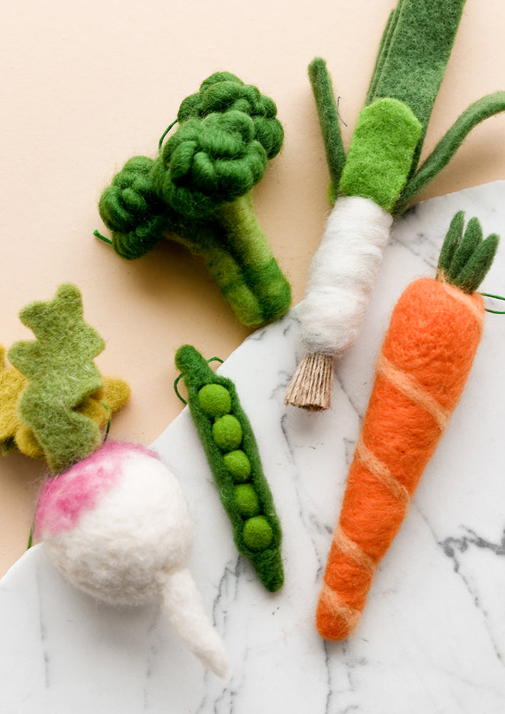 3: Felted holiday ornaments of assorted vegetables.