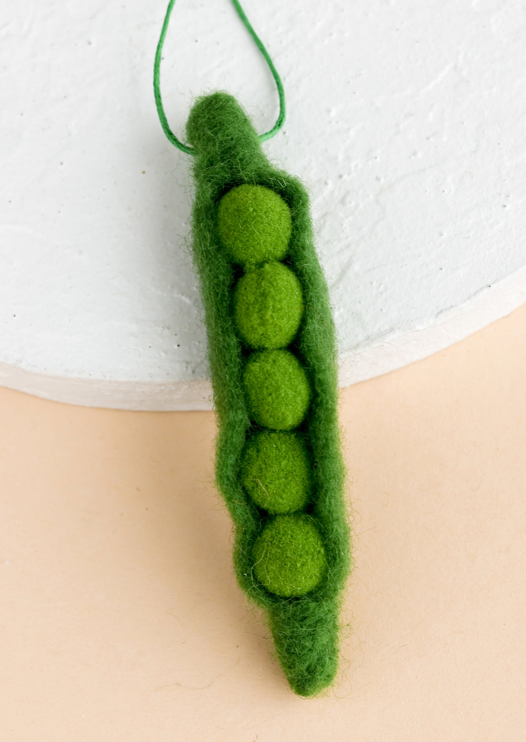 Pea: A felted ornament of a pea.