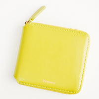 Chartreuse: Chartreuse leather wallet that zips on three sides, with matching tab pull.
