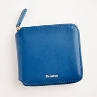 Deep Blue: Dark blue leather wallet that zips on three sides, with matching tab pull.