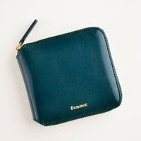 Sea Green: Dark green leather wallet that zips on three sides, with matching tab pull.