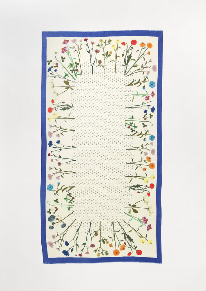 A floral printed scarf with flower border and dotted middle.