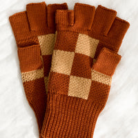 Terracotta Checker: A pair of knit fingerless gloves in terracotta checker.