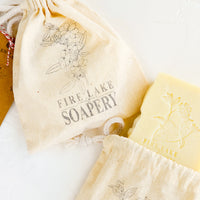 2: Floral stamped muslin bags containing bar soap.