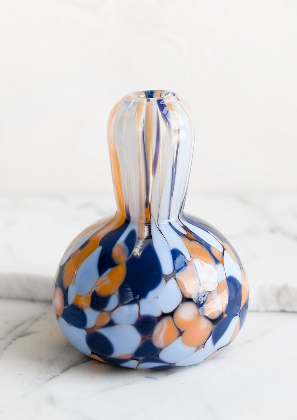 Gourd: A gourd shaped bud vase in hand blown glass with blue and orange speckle pattern.