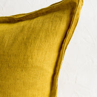 4: A decorative flange border on a linen pillow.