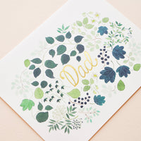 2: Greeting card with green floral print frame around "Dad" printed in gold text