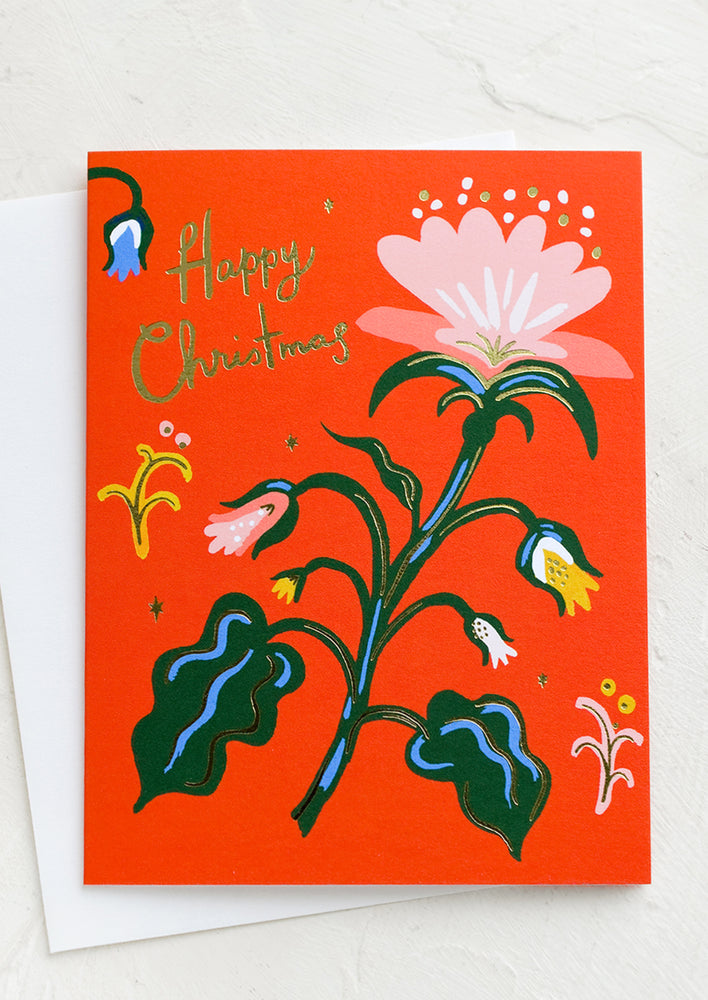 1: A red greeting card with flower, text reads "Happy Christmas".