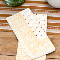 2: A pair of napkins on a table.