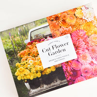 1: Photographic printed box containing a floral themed jigsaw puzzle