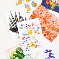 2: Product shot showing multiple styles of floral postcards.