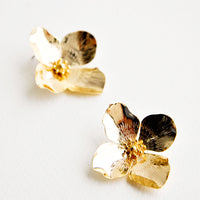 1: Shiny gold flower shaped earrings with four petals. 