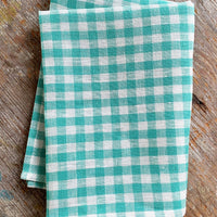 Turquoise Gingham: A linen tea towel in turquoise and white gingham.