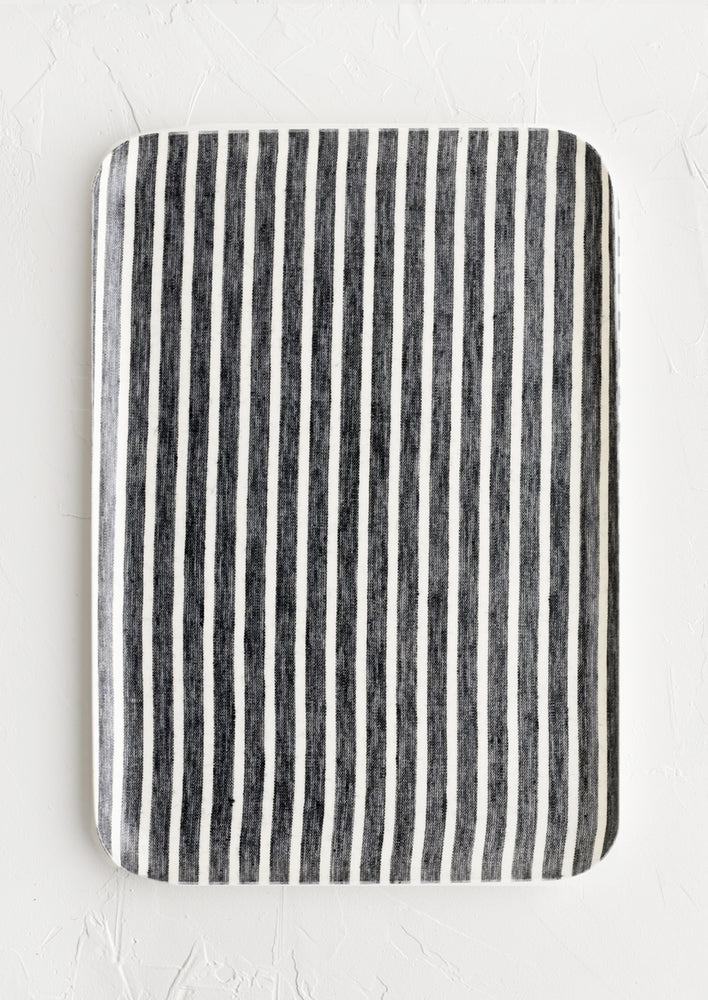 A large tray in black and white stripe.