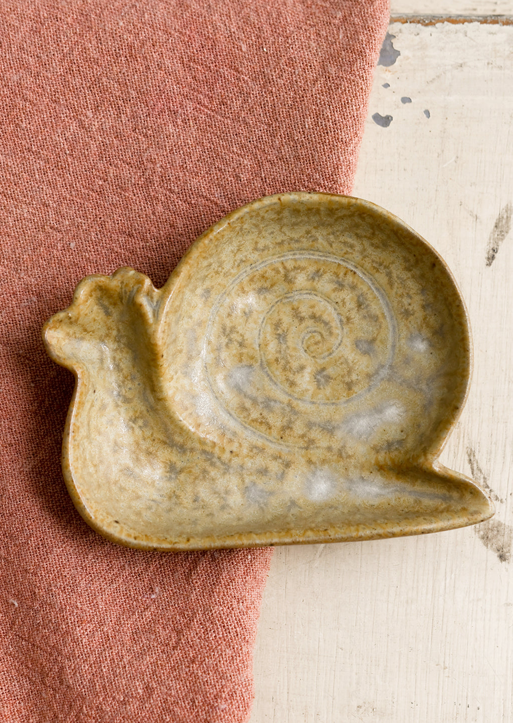 Snail: A snail shaped trinket dish in beige.
