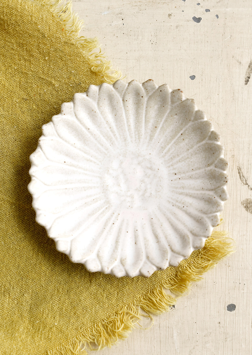 White Flower: A flower shaped trinket dish in white.