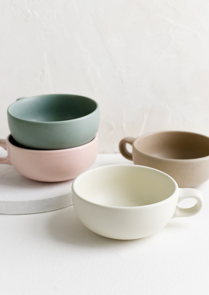 Assorted colors of ceramic mug bowls.