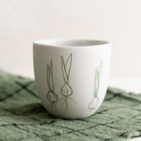 Small / Spring Onion: A small porcelain cup with hand drawn spring onions.