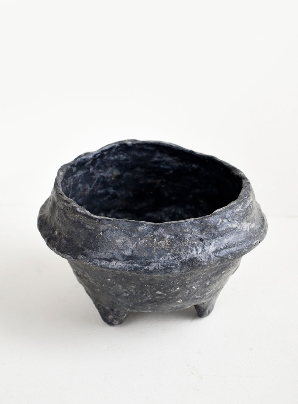 Black: Small, decorative paper mache bowl in footed silhouette and black in color
