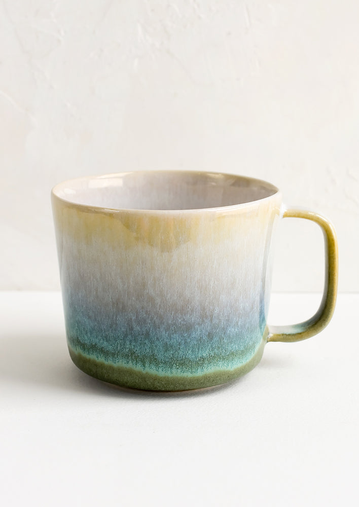 4: A ceramic mug in green with ombre glaze.
