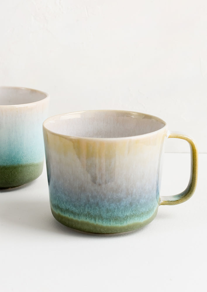 A ceramic mug with ombre glaze.