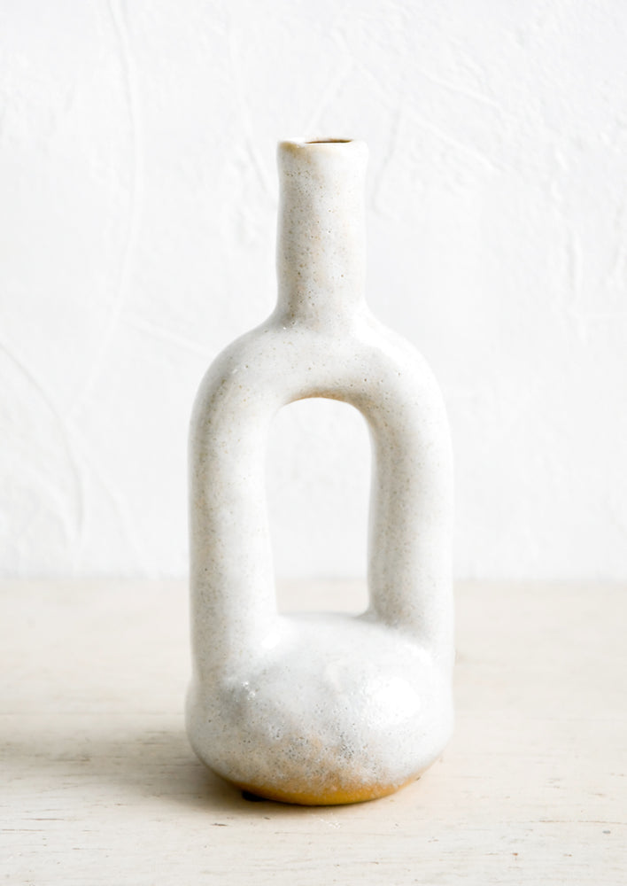 Ceramic bud vase in off-white glaze with hollow center